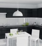 Чёрный гарнитур на кухне в эффектном стиле минимализм